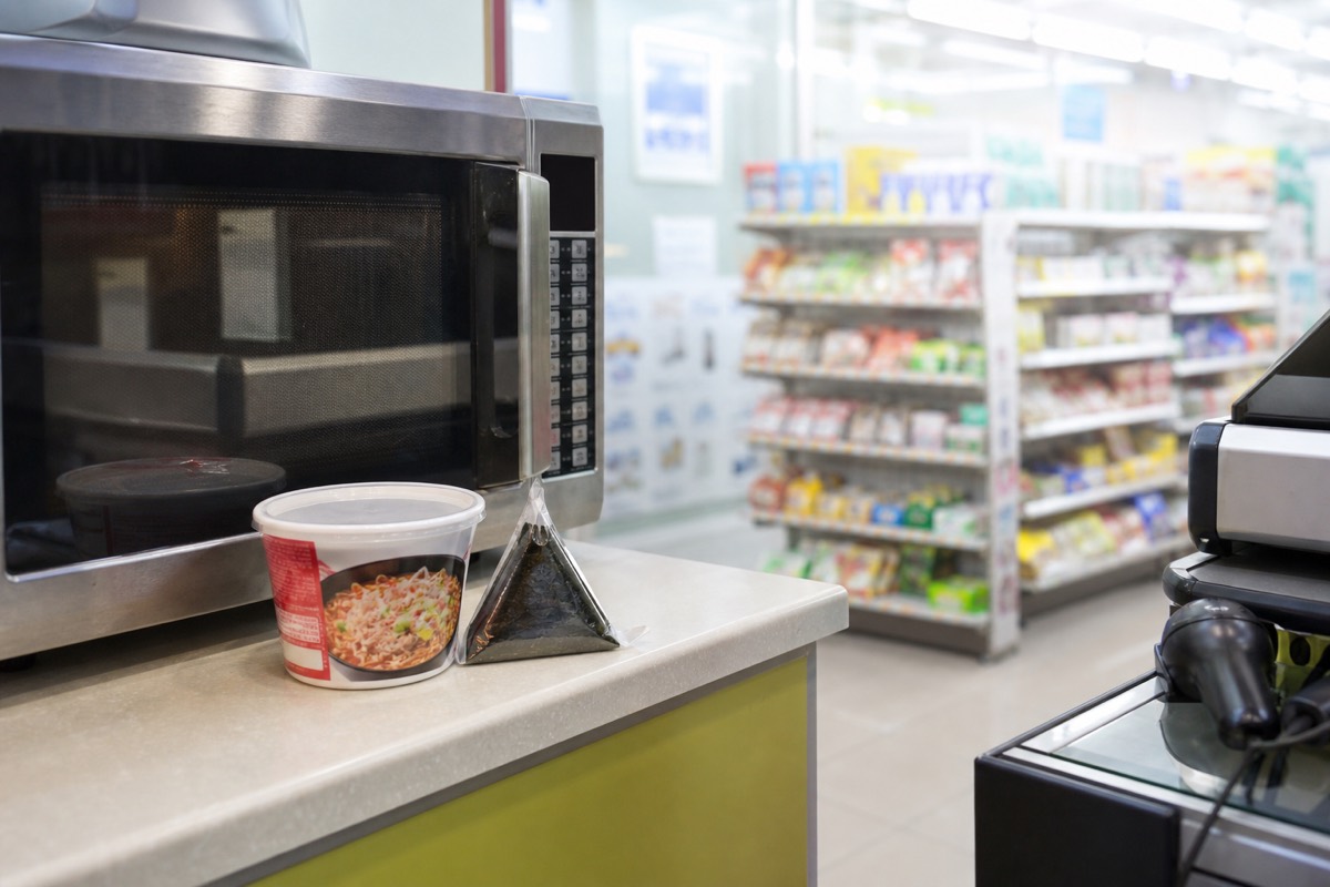 A Korean convenience store counter with a hot snack warmer